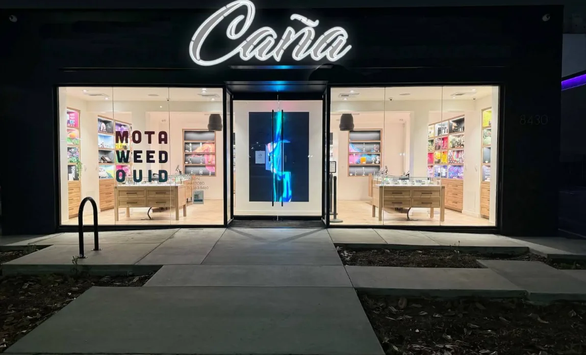 Home 4 The lit Caña Beverly storefront at night on Beverly Blvd